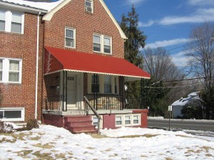 Removing snow from an awning